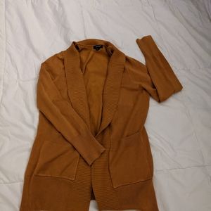 Rust/mustard colored open front cardi